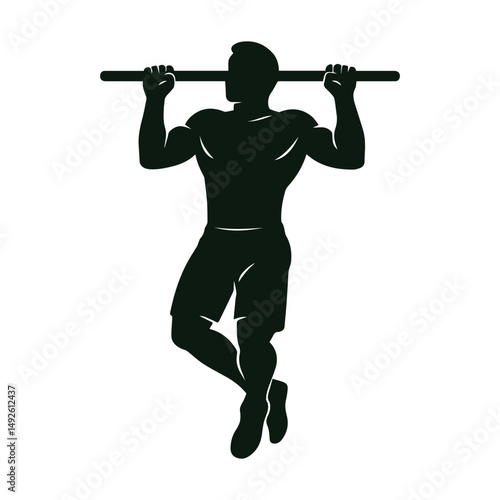 Silhouette of a Man Performing a Pull-Up Exercise in Gym