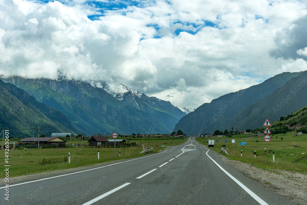 Naklejka premium Asphalt road in the mountains. Highway in the mountains.