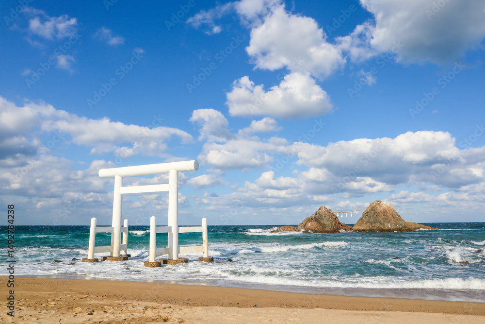 A serene coastal view featuring the iconic white torii gate in the sea, japan. A serene coastal view featuring the iconic white torii gate in the sea, japan.