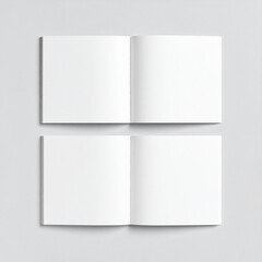 Two open square book mockups showing blank pages on gray background
