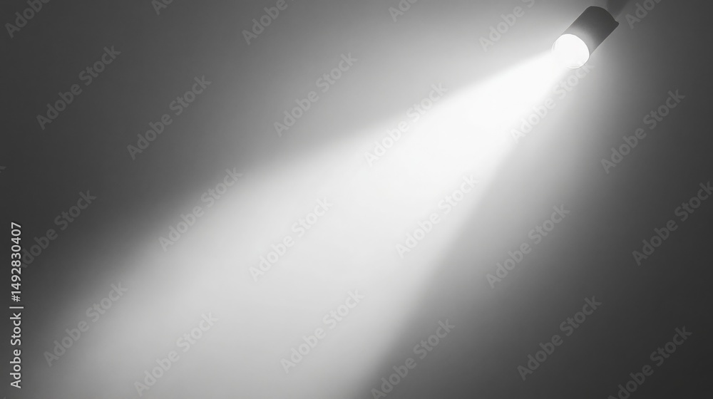 Naklejka premium a bright spotlight shines downward on a dark gray background