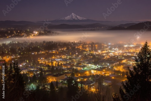 Night aerial of McMinnville Oregon with fog and Mount Hood in background landscape photography