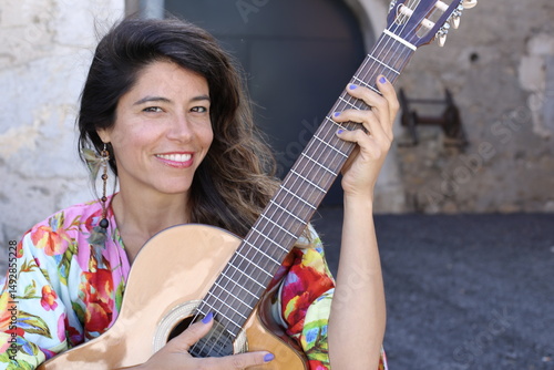 Woman playing the acoustic guitar 