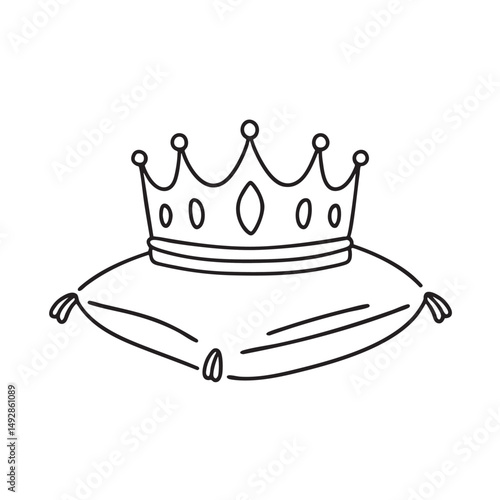 A tiara sitting atop a pillow