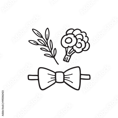 A tie bow placed near a boutonniere on a desk