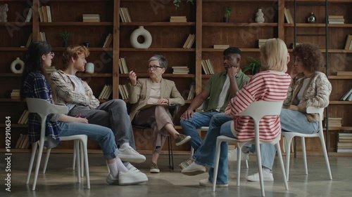Group of Diverse Adults Talking in Circle During Therapy Session