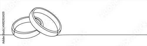 Wedding rings continuous one line drawing. Hand drawn proposal engagement and love marriage concept.
