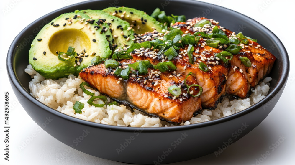 Delicious salmon fillet with avocado on rice bowl, garnished with sesame and green onions Delicious salmon fillet with avocado on rice bowl, garnished with sesame and green onions