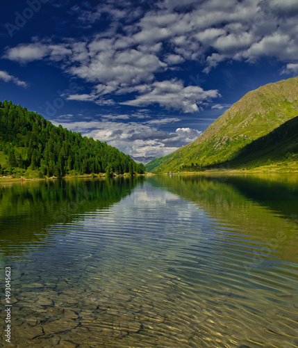 View on Obersee lake and mountains above Defereggental valley on a summer day
