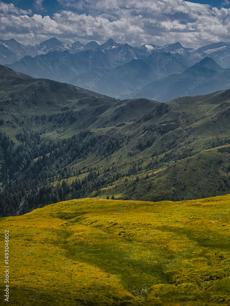 Fototapeta premium View on High Tauern / Hohen Tauren natural park from mountains near Saalbach Hinterglemm Leogang ski resort during summer day