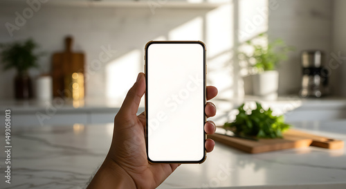 Modern Smartphone Mockup Blank Screen in a Bright Kitchen Setting. Perfect for App Presentations, Website Designs, and Mobile UI Showcase.
