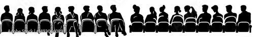 In the auditorium, a crowd of people has assembled, forming the audience for a cinema or theater event, where a public presentation is taking place, marked by the presence of anonymous faces,