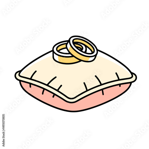 Wedding rings resting on plush pillow in blush and champagne colors  