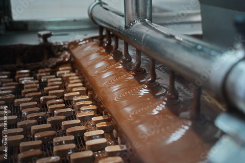 The candies are filled with a large layer of chocolate. Factory.