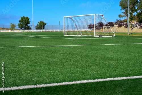 Wallpaper Mural Soccer field with rollaway goal post on artificial synthetic green grass turf Torontodigital.ca