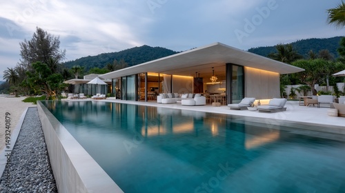 Wallpaper Mural Luxurious beachfront villa with infinity pool, large windows, and serene setting Torontodigital.ca