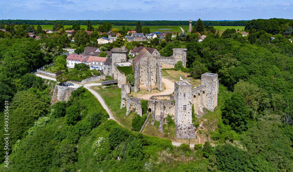 Fototapeta premium Aerial view of the Château de la Madeleine (Madeleine Castle) overlooking the village of Chevreuse in the French department of Yvelines in the capital region of Ile-de-France near Paris
