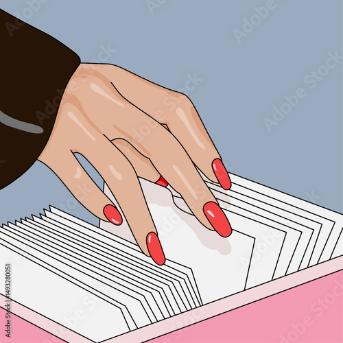 Close up of a Woman's Hand Searching for Documents in a Filing Cabinet