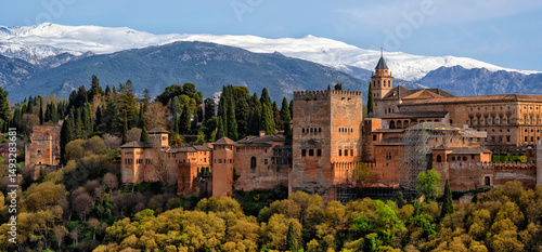 Granada. Spain. The fortress and palace complex Alhambra. A beautiful city in Spain with the Sierra Nevada mountains in the background. Travel and  Tourism