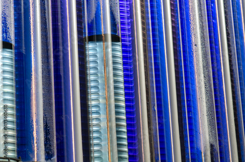 Fotografie Close-up view of evacuated glass tubes in a solar water heating system