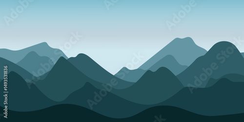 A landscape with silhouettes of mountains against the sky. The mountains have different shades of blue and green, creating the effect of depth. A field with grass is visible in front of the mountains.