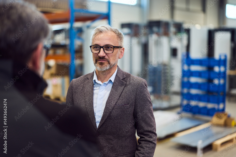 Professional Man in a Business Meeting Inside an Industrial Workplace Environment Professional Man in a Business Meeting Inside an Industrial Workplace Environment