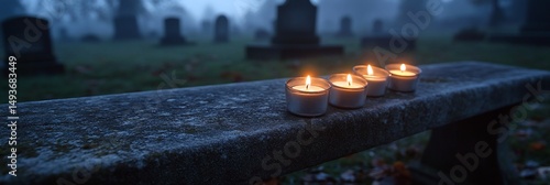 Cemetery candles with misty dawn.