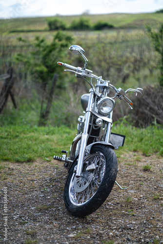 Detail shot of a metallic engine and bodywork of a custom motorcycle.