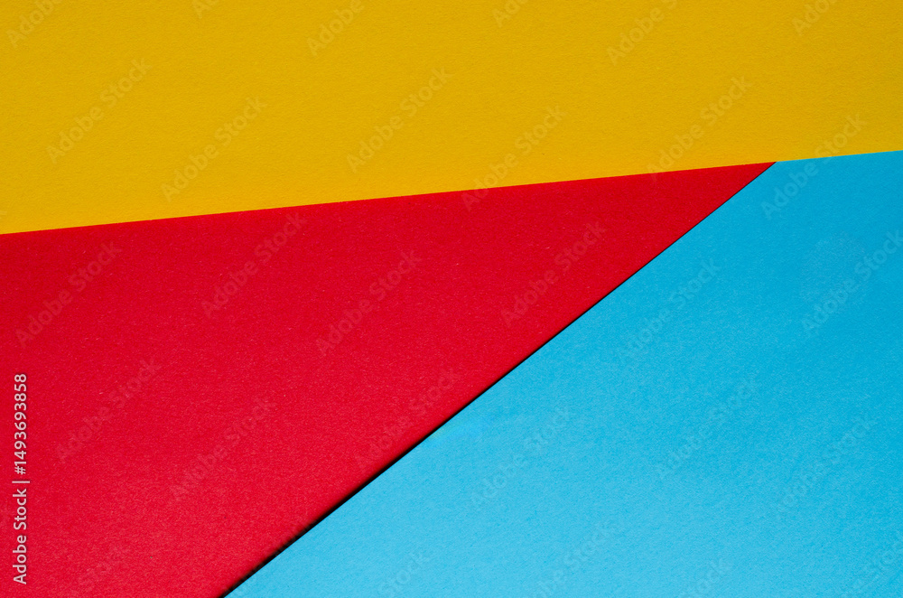 Colorful geometric abstract background with red, yellow and blue paper shapes for design, banner, poster or presentation, studio shot Colorful geometric abstract background with red, yellow and blue paper shapes for design, banner, poster or presentation, studio shot