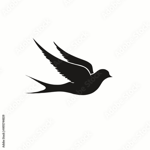 black silhouette of a swift swallow in mid-flight captures elegance and freedom. Perfect for tattoos, logos, or nature-themed designs, its minimalist style exudes high value for Adobe Stock users seek