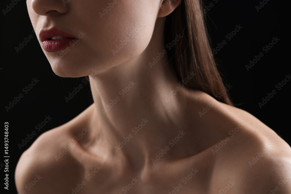 Woman with perfect skin on black background, closeup Woman with perfect skin on black background, closeup