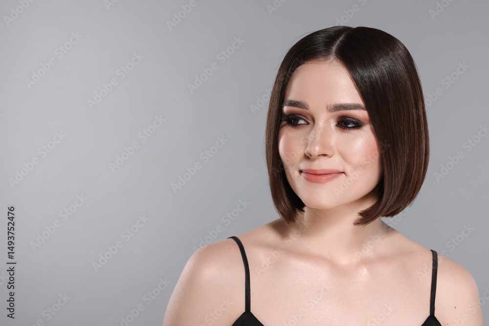 Portrait of beautiful young woman with gorgeous straight hair on light grey background, space for text Portrait of beautiful young woman with gorgeous straight hair on light grey background, space for text