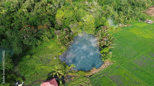 Aerial View of Sulphur Thermal Lakes for Swimming in Ranolewo, Tomohon – Volcanic Landscape and Rice Fields in North Sulawesi, Indonesia..