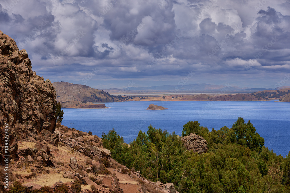 Fototapeta premium From the heights of Amantaní Island, Lake Titicaca stretches endlessly—its deep blue waters reflecting the sky and the spirit of the Andes.