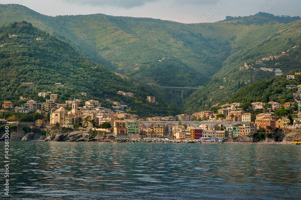 Fototapeta premium View from the Mediterranean sea of the colorful buildings of the town of Nervi in the mountains, Liguria, Genoa, Italy, Europe