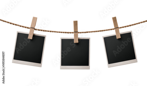 Wallpaper Mural Three Blank Polaroid Photos Hanging on a Twisted Rope with Wooden Clothespins, Perfect for Display and Decoration, Isolated on Transparent and White Background Torontodigital.ca