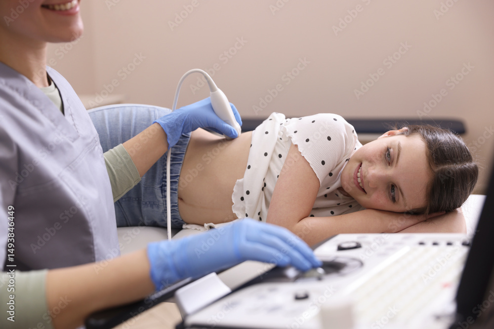 custom made wallpaper toronto digitalSonographer conducting girl's renal ultrasound examination in clinic, closeup