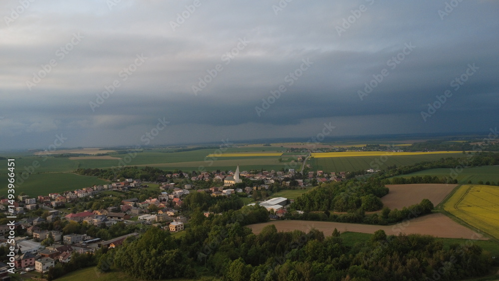 Beautiful Spring Panorama of Hněvošice Village with Blooming Rapeseed and Dramatic Sky Beautiful Spring Panorama of Hněvošice Village with Blooming Rapeseed and Dramatic Sky
