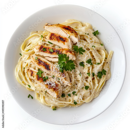 A classic Italian pasta dish featuring fettuccine coated in a rich, velvety Alfredo sauce. The pasta is topped with grilled chicken slices, freshly grated Parmesan cheese, and a sprinkle of parsley,