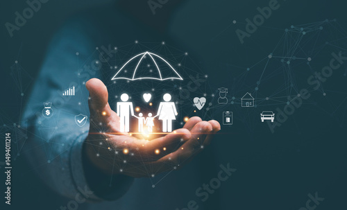 Family life insurance concept, Businessman holding family icon with protection and related icons such as car, home, investments, hospital, savings, travel, Planning for the future life of the family.
