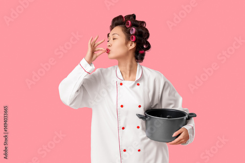 Female Asian chef with hair...