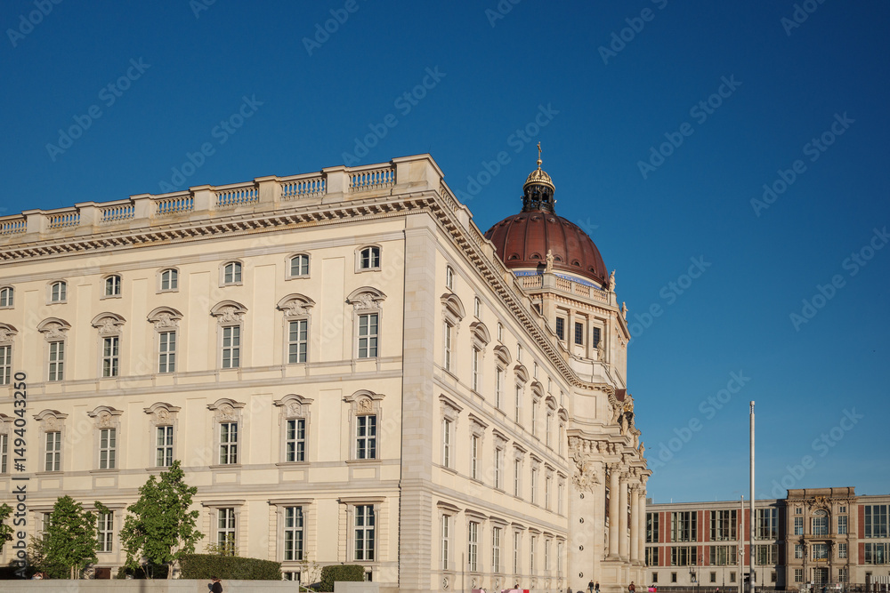 Obraz premium The Humboldt Forum situated along the Spree River on a sunny day in Berlin, Germany. 