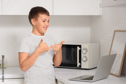 Mute boy using sign languag...