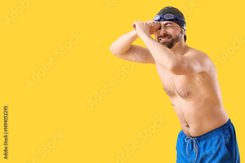 Male swimmer looking at som...