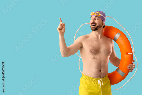 Male swimmer with ring buoy...