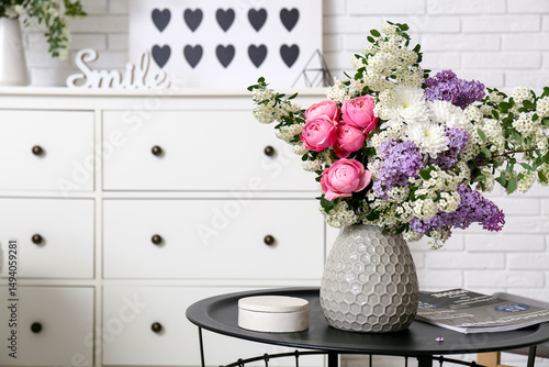 Box, magazine and vase with...