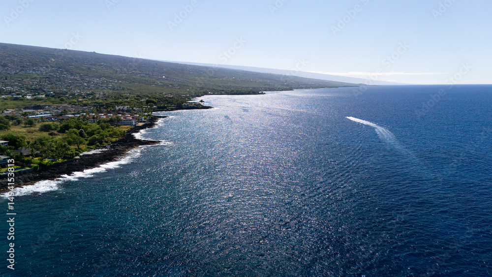Aerial view of Kona coastline with boat Aerial view of Kona coastline with boat