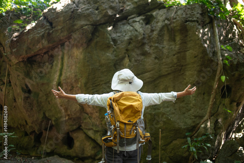 Older trekking adventure carries backpacks poles enjoying nature expression looks into the distance observing and possibly guide trekking and trail ecotourism adventure concept.