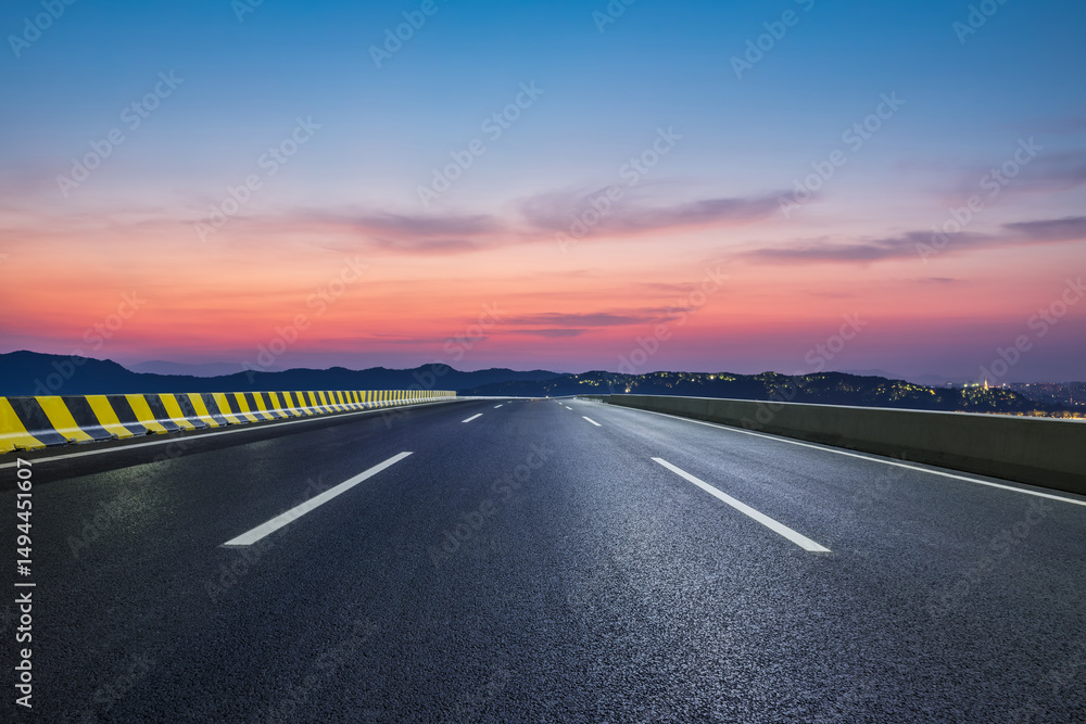 Naklejka premium Empty asphalt highway road and mountain with beautiful sky clouds at dusk