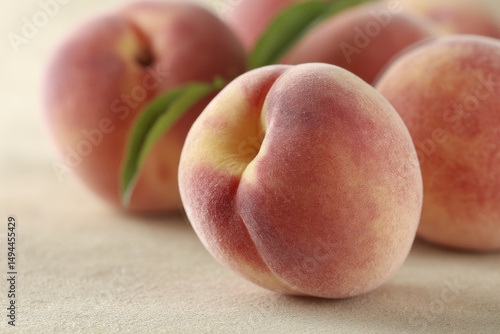 closeup of juicy peaches resting on soft textured background with ultrabright colors like watermelon tangerine